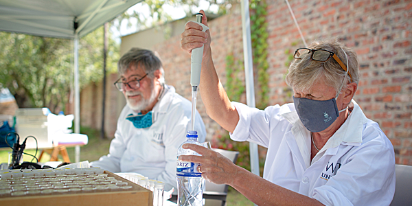 Professors Mary and Bob Scholes testing water at Wakkerstroom